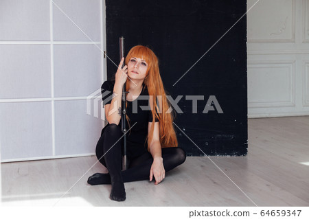 red-haired girl with a Japanese sword cosplayer anime Japan red-haired girl with a Japanese sword cosplayer anime Japan 64659347