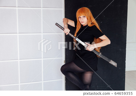 Portrait of a beautiful girl with a Japanese sword cosplayer anime Japan Portrait of a beautiful girl with a Japanese sword cosplayer anime Japan 64659355