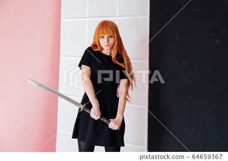 Portrait of a beautiful girl with a Japanese sword cosplayer anime Japan Portrait of a beautiful girl with a Japanese sword cosplayer anime Japan 64659367