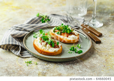 Canape or crostini with toasted baguette, cottage Canape or crostini with toasted baguette, cottage 64660045