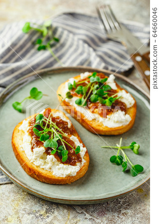 Canape or crostini with toasted baguette, cottage Canape or crostini with toasted baguette, cottage 64660046