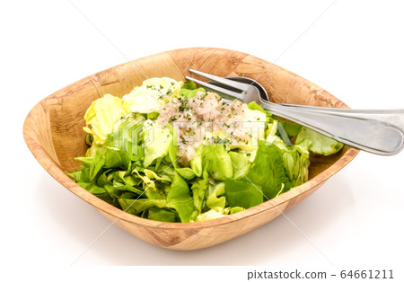fresh green lettuce salad in a bowl 64661211