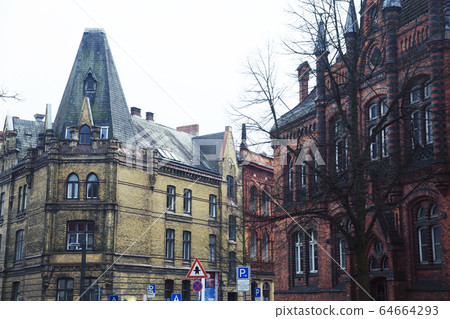 Post card view amber house in Germany Hamburg, european street and roofs closeup Post card view amber house in Germany Hamburg, european street and roofs closeup 64664293