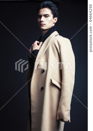 handsome asian fashion looking man posing in studio on black background, lifestyle modern people concept handsome asian fashion looking man posing in studio on black background, lifestyle modern people concept 64664298