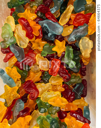 lots of delicious sweet candies for eating a pastry background 64664375