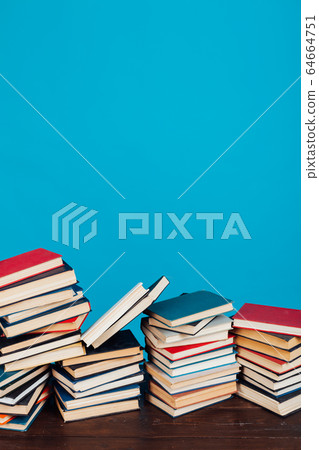 many stacks of educational books for learning preparation for college exams on a blue background many stacks of educational books for learning preparation for college exams on a blue background 64664751