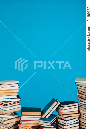 many stacks of educational books for learning preparation for college exams on a blue background many stacks of educational books for learning preparation for college exams on a blue background 64664754