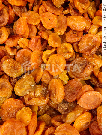 lots of dried sweet apricot apricot dried apricots as a background 64665887