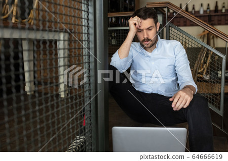 Restaurant, cafe, bar closed due to COVID-19 or Coronavirus outbreak lockdown, stressed owner of small business trying to find solution 64666619