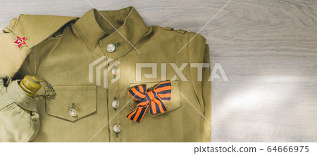 9 May holiday of Victory day 1945 background. Soviet army military uniform of tunic, forage cap, St. George ribbon, flask on wood background. Flat lay, layout, banner, top view, copy space 9 May holiday of Victory day 1945 background. Soviet army military uniform of tunic, forage cap, St. George ribbon, flask on wood background. Flat lay, layout, banner, top view, copy space 64666975