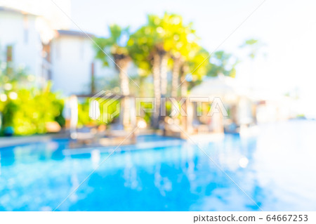 Abstract blur and defocus outdoor swimming pool in hotel resort for background Abstract blur and defocus outdoor swimming pool in hotel resort for background 64667253