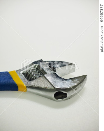 White background with monkey spanner and tools White background with monkey spanner and tools 64667577