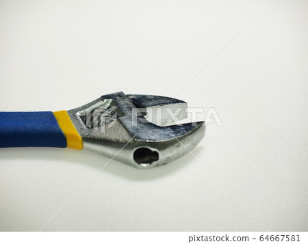 White background with monkey spanner and tools White background with monkey spanner and tools 64667581