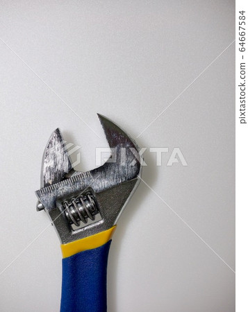 White background with monkey spanner and tools White background with monkey spanner and tools 64667584