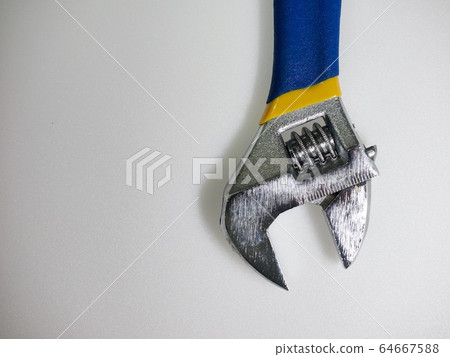 White background with monkey spanner and tools White background with monkey spanner and tools 64667588
