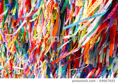 Famous touristic place where people make wishes while tie the ribbons in front of the church. Famous touristic place where people make wishes while tie the ribbons in front of the church. 64667685