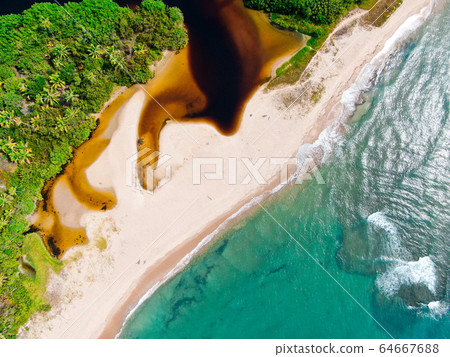 Aerial top view of river merging to tropical white sand beach and turquoise clear sea water ocean Aerial top view of river merging to tropical white sand beach and turquoise clear sea water ocean 64667688
