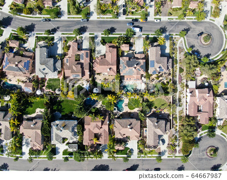 Aerial view suburban neighborhood with identical villas next to each other. San Diego, California 64667987