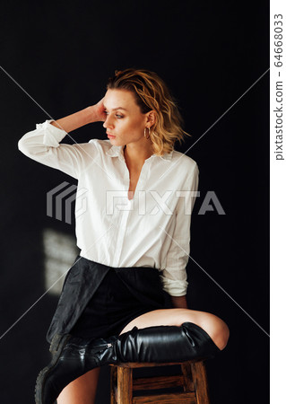 Portrait of a beautiful fashionable stylish woman in clothes poses Portrait of a beautiful fashionable stylish woman in clothes poses 64668033