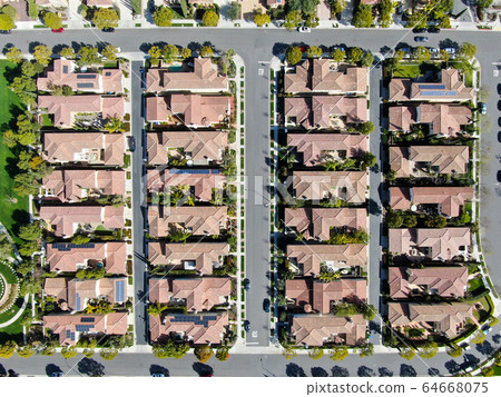 Aerial view suburban neighborhood with identical villas next to each other. San Diego, California 64668075