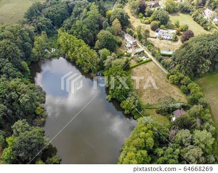 Aerial top view of country side landscape with forest and lake, 64668269