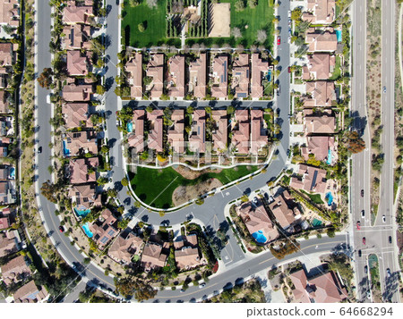 Aerial view suburban neighborhood with identical villas next to each other. San Diego, California 64668294