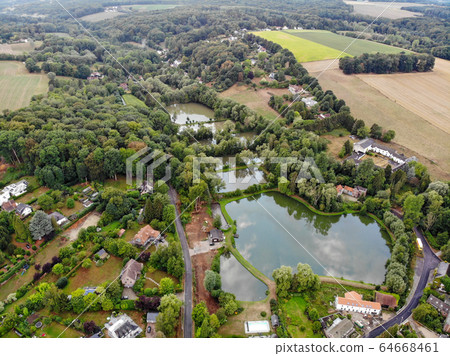 Aerial top view of country side landscape with forest and lake, 64668461