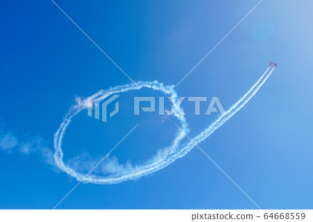 Plane doing acrobatic formation in the blue sky. Airplanes on airshow 64668559
