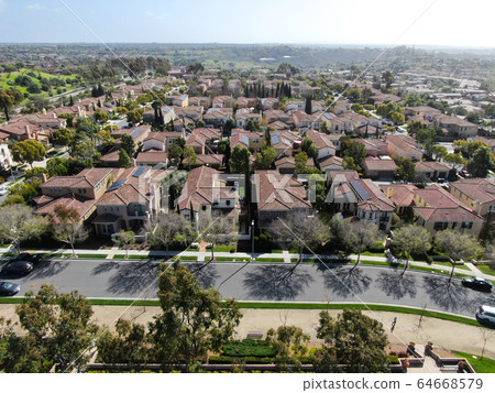 Aerial view suburban neighborhood with identical villas next to each other. San Diego, California 64668579