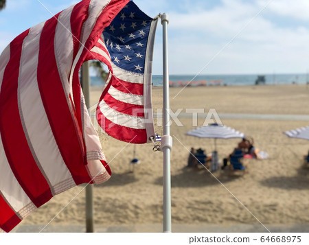 American flag with the beach on the background American flag with the beach on the background 64668975