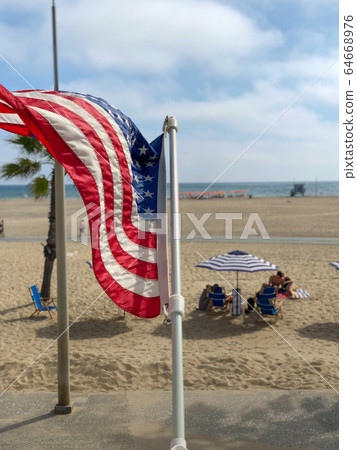American flag with the beach on the background American flag with the beach on the background 64668976