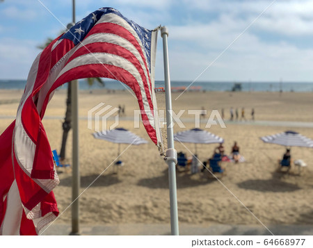 American flag with the beach on the background 64668977