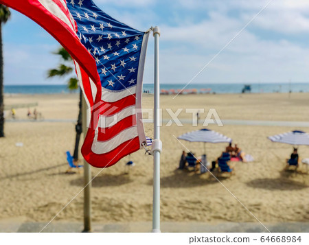 American flag with the beach on the background 64668984