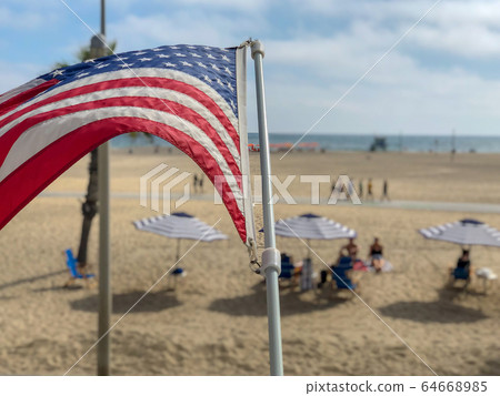 American flag with the beach on the background 64668985