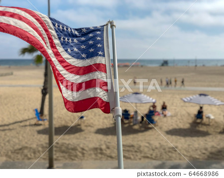 American flag with the beach on the background American flag with the beach on the background 64668986