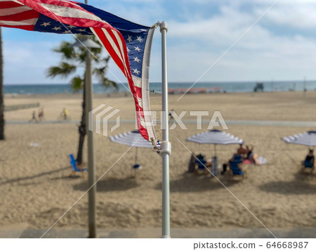 American flag with the beach on the background American flag with the beach on the background 64668987