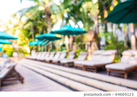 Abstract blur outdoor swimming pool in hotel resort Abstract blur outdoor swimming pool in hotel resort 64669123