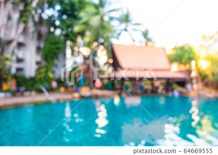 Abstract blur outdoor swimming pool in hotel resort Abstract blur outdoor swimming pool in hotel resort 64669555