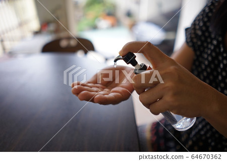 Wash hands with alcohol gel. To prevent the coronavirus outbreak covid-19 64670362
