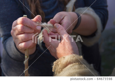 the hands that spin wool fleece by hand 64673598