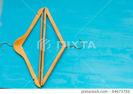 old wooden hangers for things on the table background old wooden hangers for things on the table background 64673788