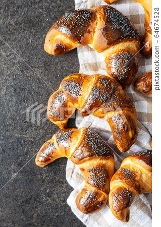 Sweet homemade croissants with poppy. 64674528