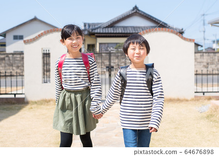 Smiling sisters going home Smiling sisters going home 64676898