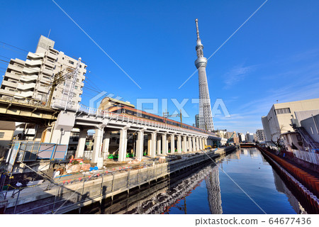 Waterside maintenance and sky tree of Kitajukken River 64677436