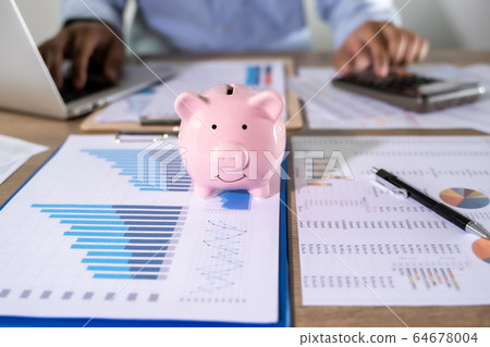Man Usingcalculator with money stack Financial Man Usingcalculator with money stack Financial 64678004