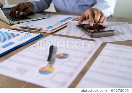Man Usingcalculator with money stack Financial Man Usingcalculator with money stack Financial 64678005