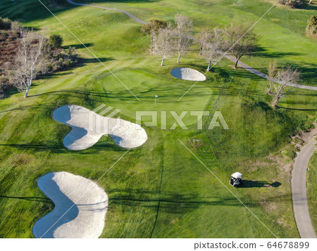 Aerial top view of golf course with green field Aerial top view of golf course with green field 64678899