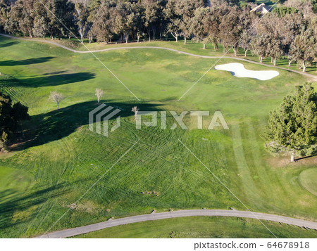 Aerial top view of golf course with green field Aerial top view of golf course with green field 64678918
