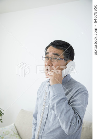 Senior man getting angry while calling 64679950
