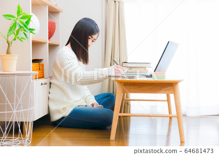 Female PC reference book sticky note copy space to write in notebook 64681473